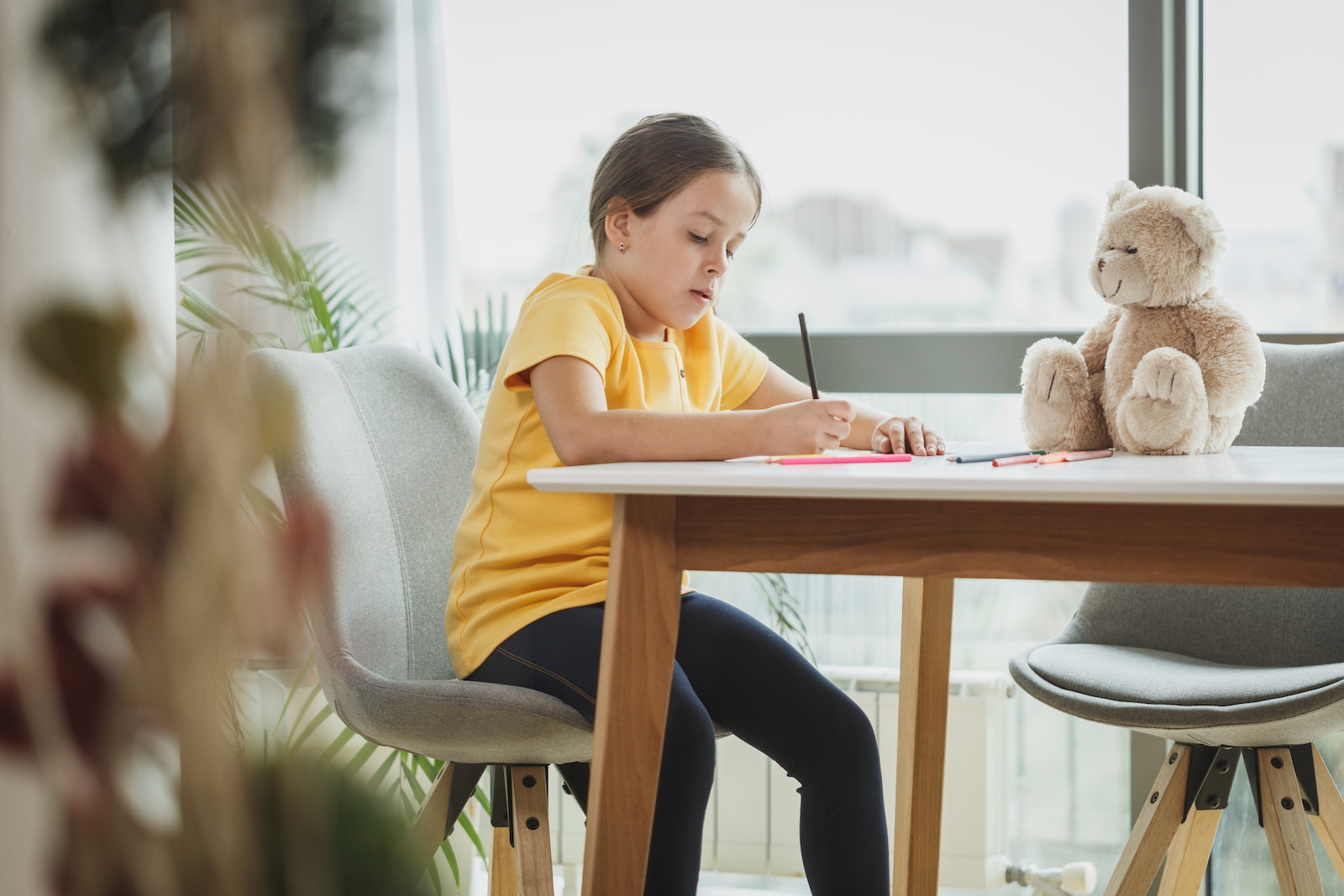 Child drawing with crayons